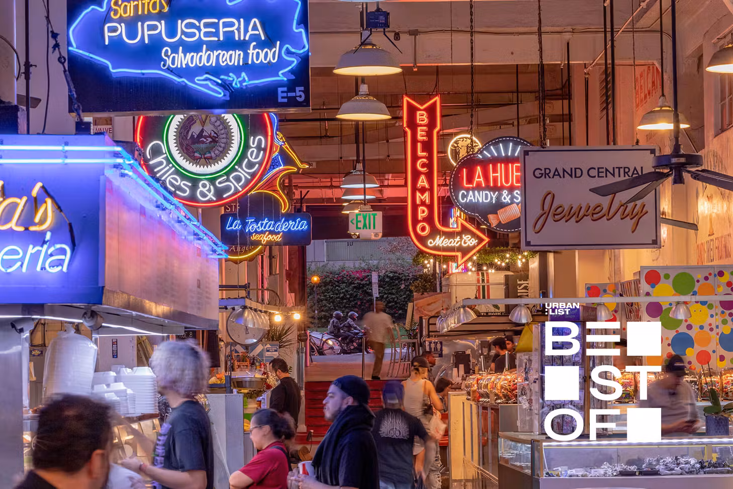 a busy marketplace with neon lights